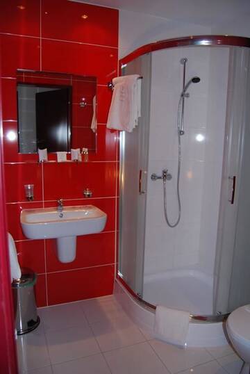 Фото номера Семейный номер с ванной комнатой Отель Amigo Hotel г. Сулеювек 4